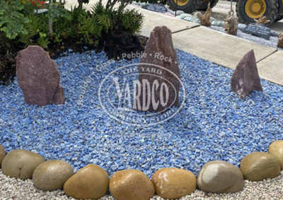 Blue Macaubas Gravel with Red Aventurine Boulders on Display
