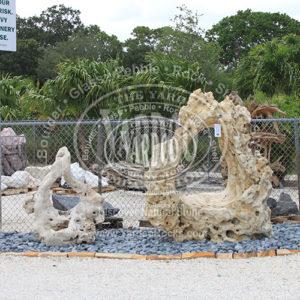 Two Imported Holey Limestone One -Hole Sculpture