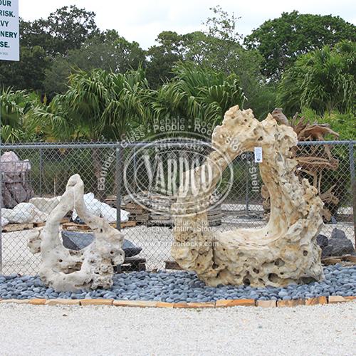 Two Imported Holey Limestone One -Hole Sculpture