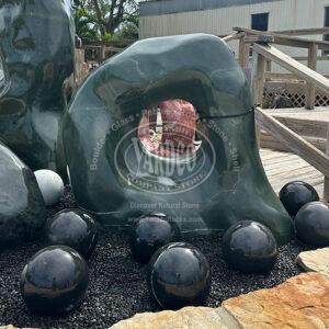 Imported green marble one-hole sculpture on display at Yardco’s front landscape bed.