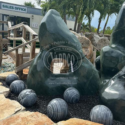 Imported green marble one-hole sculpture on display at Yardco’s front landscape bed.