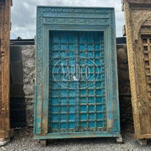 102-inch Indian teak door with ornate antique carvings and a deep, warm finish.