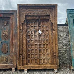 106-inch Indian teak door with intricate antique carvings and a rich, warm finish.