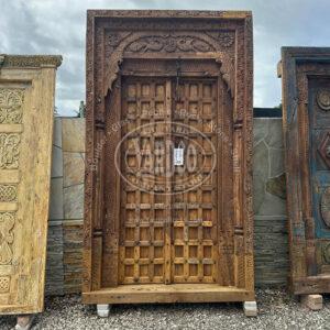 107-inch Indian teak door with intricate antique carvings and a warm, rich finish.