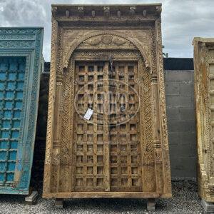 113-inch Indian teak door with elaborate antique carvings and a luxurious, warm finish.