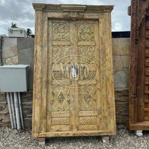 95-inch Indian teak door with antique carvings and a rich, warm finish.