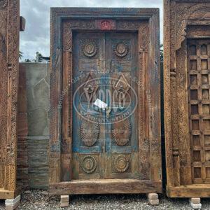 96-inch Indian teak door with detailed antique carvings and a golden-brown finish.