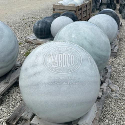 Elegant white and gray marble sphere with subtle veining and a polished finish.